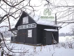 Drewnolandia domek drewniany Mieszko II - domek letniskowy z tarasem bocznym