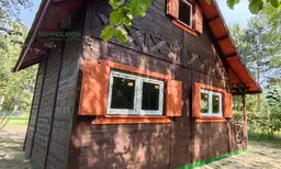 Drewniany domek letniskowy Mieszko II Drewnolandia - domek całoroczny