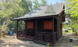Letniskowy domek drewniany z tarasem Mieszko II - całoroczny domek drewniany